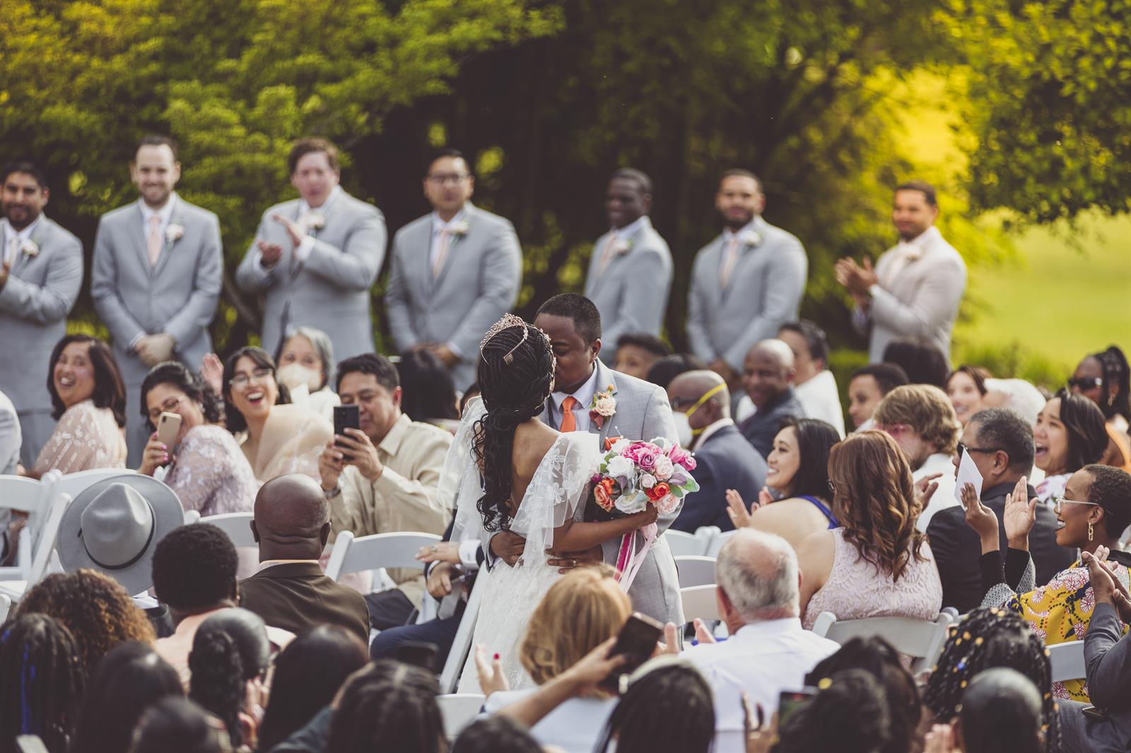 Wedding couple kissing outside